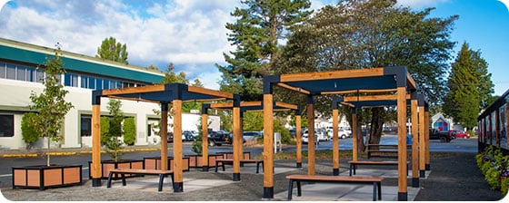 Aylesbury Backless Benches and Rutherford Planters By Wishbone Site Furnishings