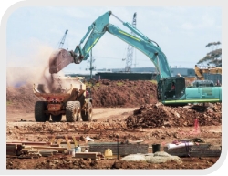 Building Construction Site with Teal Bulldozer